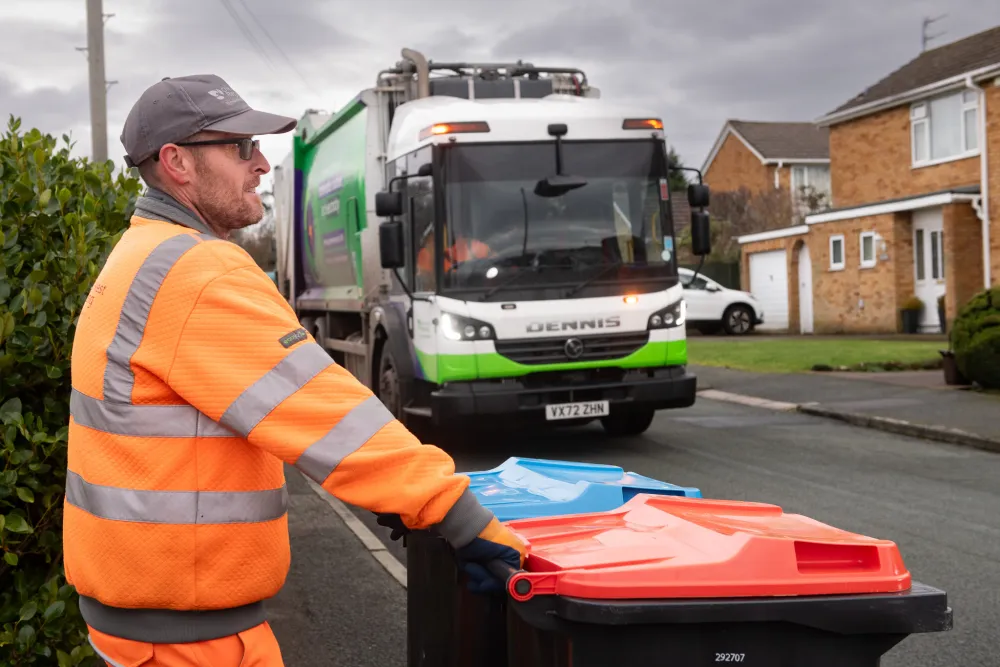 Recycling containers with loader awaiting collection vehicle