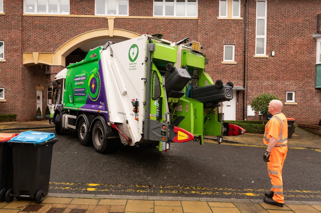 A refuse truck collects domestic waste